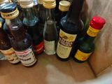 many bottles of alcohol sitting in a paper bag