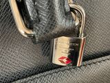 a close up of a purse with a padlock on it