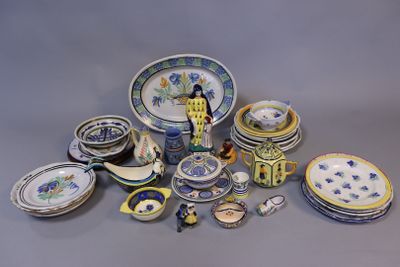 many different types of plates and bowls on the table