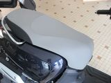a motor scooter that is parked in a room