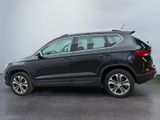 the rear view of a black volkswagen suv parked in a parking lot