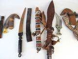many different types of knifes and other items on the table