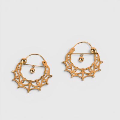 a pair of gold earrings on a white background
