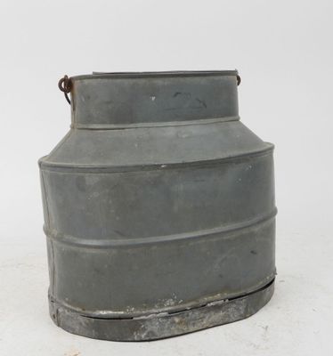 a metal container that is sitting on the ground