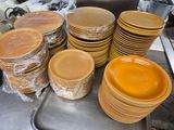 a lot of plates that are sitting on a table