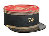 a black hat with a red and gold number on it