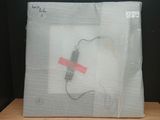 a picture of a piece of plastic with a cord in it