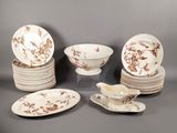 a lot of plates and bowls that are sitting on a table