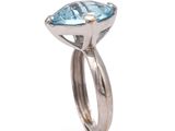 an image of a ring with a blue topazr stone in it