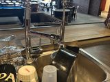 a sink that has a lot of items in it