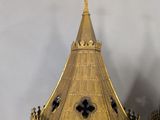 pair of gold colored clock towers with a cross on each of them