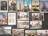 a lot of old postcards that are on the wall