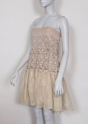 an image of a mannequin mannequine wearing a beige dress