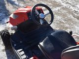 a red and black toy car with a steering wheel