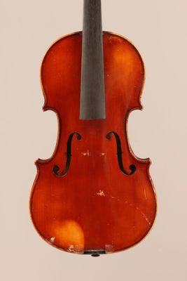 an old violin with a bow hanging from it ' s back