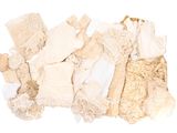 a pile of clothing that is on a white surface