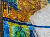 a close up of a painting of a person on a surfboard