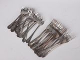 a lot of forks that are sitting on a table
