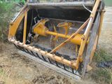 a yellow bulldozer that is sitting in the dirt