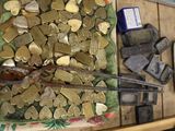 a pile of gold coins and a pair of scissors on a table