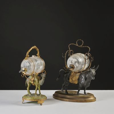 pair of bronze and glass figurines of a man on a horse and a woman on a horse