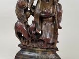 an old bronze statue of a group of people on a pedestal