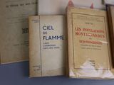 several books are lined up on a shelf in a room
