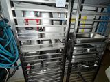 many pots and pans on the rack in the kitchen