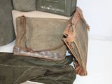 several pieces of luggage are stacked on top of each other on a table