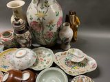 many different types of vases and bowls on the table