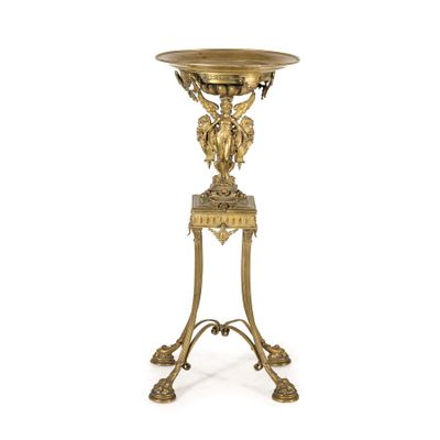 an image of a gold plate on a stand on a white background