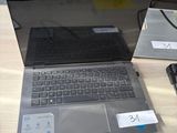 a laptop and a cell phone on a table