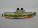 a toy boat that is sitting on top of a table