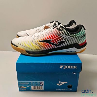 the box of a pair of tennis shoes is on a table