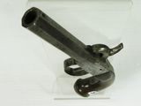 a gun that is on display in a glass case