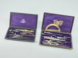 purple cased box containing a variety of tools and a gold plated ring
