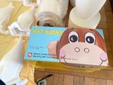 a box of toilet paper with a picture of a monkey on it