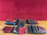 many different types of leather wallets on a table