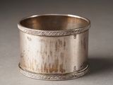 a silver cup that is sitting on a table
