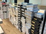 stacks of boxes stacked on top of each other in a store