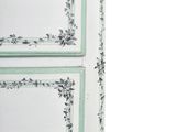 an image of a white cabinet with green trimming