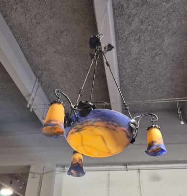 a chandelier hanging from the ceiling of a restaurant