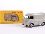 a toy truck that is sitting in front of a box