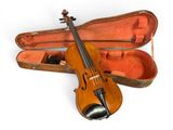 a violin that is sitting in a case on the floor