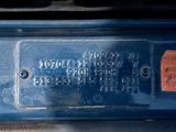 a close up of the back of a blue truck