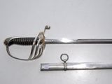 two swords that are laying on a white surface