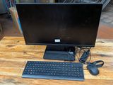 a computer on a table with a keyboard and mouse