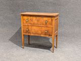 une image représentant une petite commode en bois sur fond gris