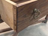 a wooden desk with a drawer on top of it