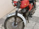a motorcycle that is parked on the side of the street